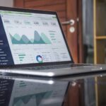 laptop open to website metrics, website automation for small businesses; new southern solutions