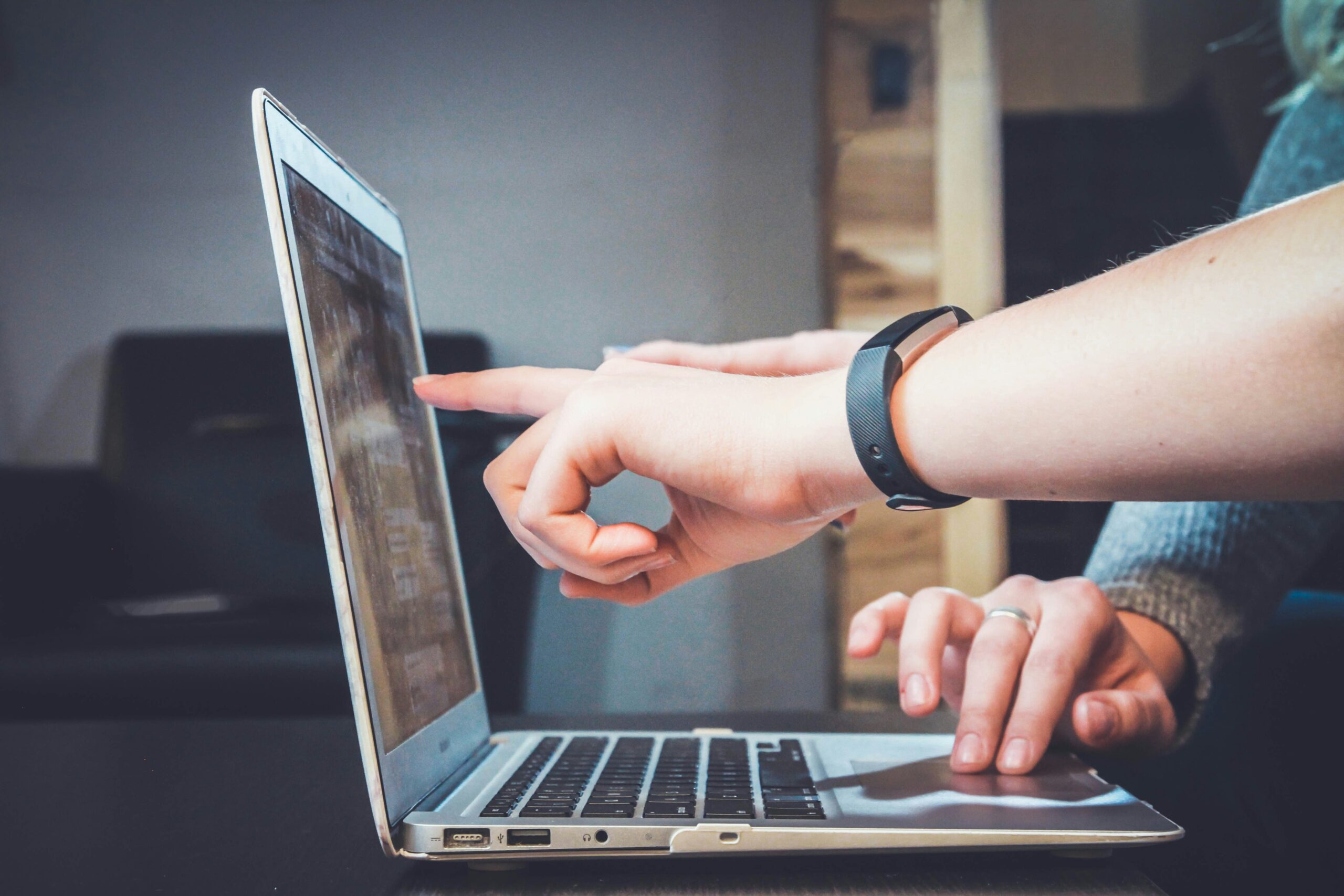 man's hand pointing at computer screen, quality calls to action, new southern solutions, web design and digital solutions