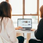 two women sitting at a laptop looking at new leads on their website, new southern solutions