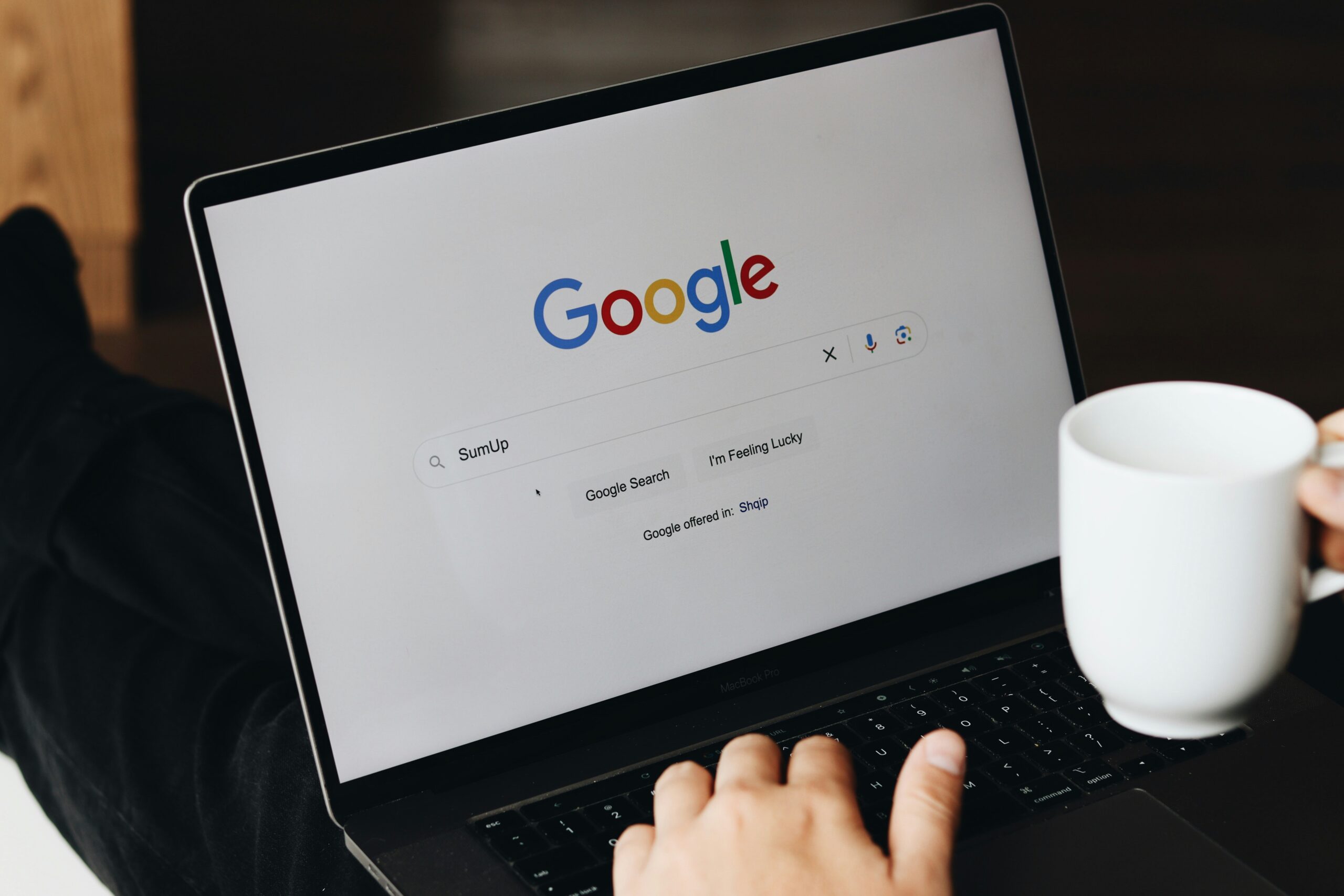Person at computer with webpage open to google; google business page optimization for businesses; new southern solutions